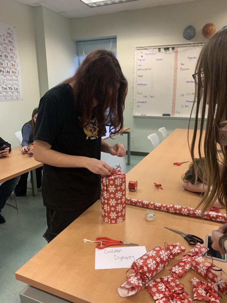 PECHS students wrapping presents