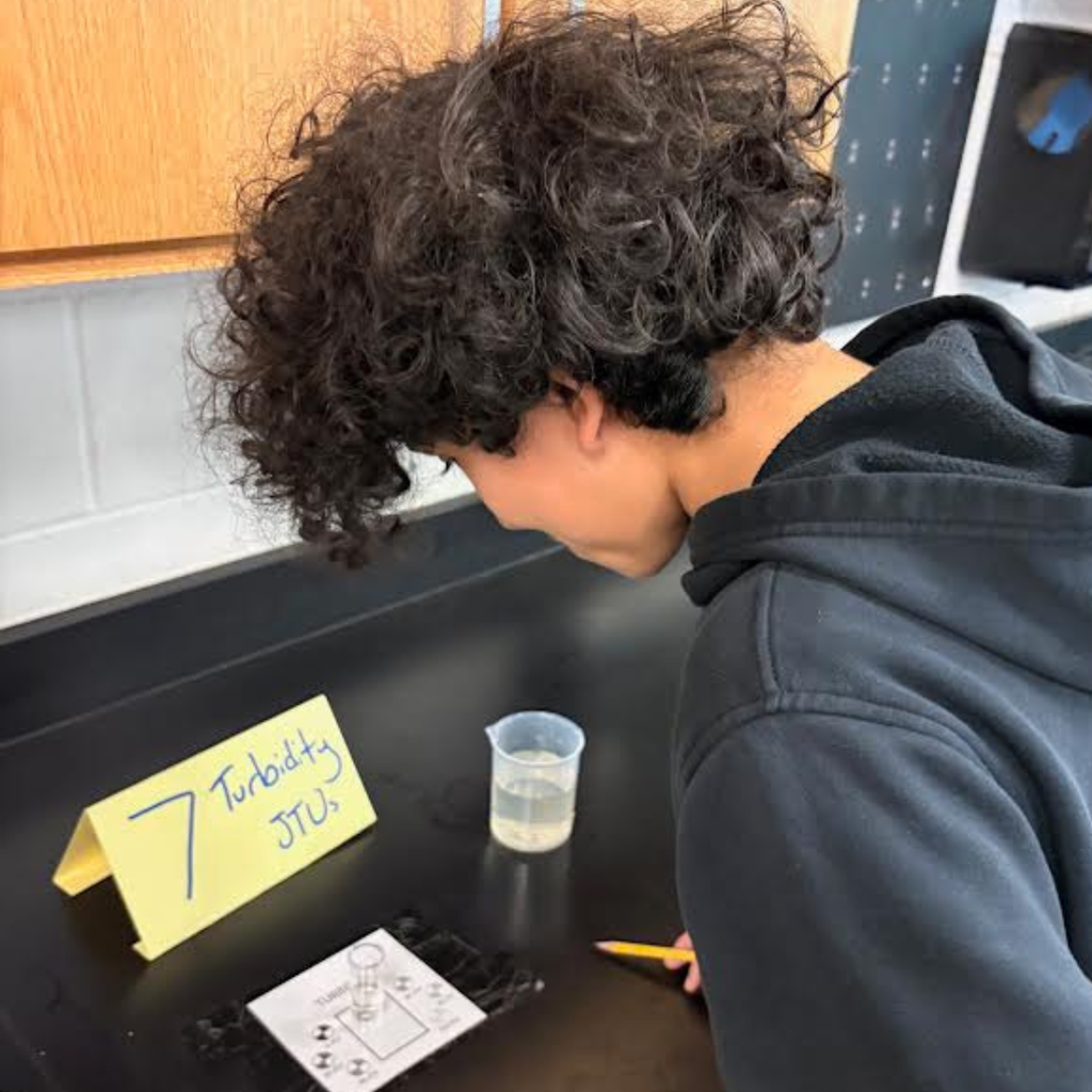 student in science class