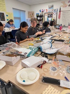 The kids are enjoying a project provided by the National Inventors Hall of Fame. It is called Circuit Sculptures.