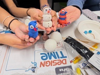 The kids are enjoying a project provided by the National Inventors Hall of Fame. It is called Circuit Sculptures.