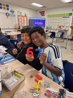 The kids are enjoying a project provided by the National Inventors Hall of Fame. It is called Circuit Sculptures.