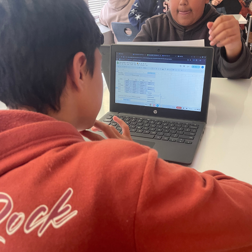 student on computer in classroom