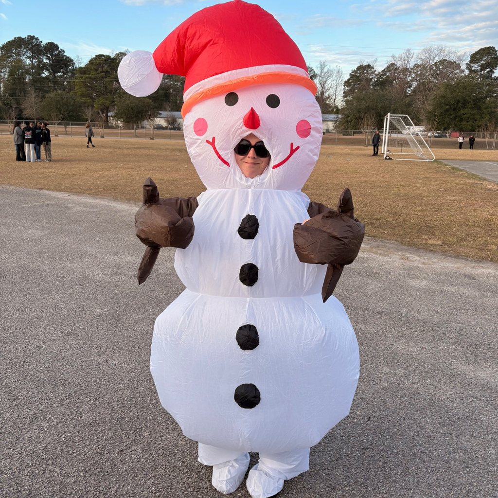 staff member dressed in blow up snowman