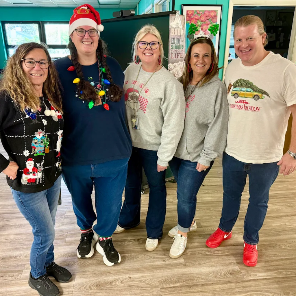 staff members dressed in holiday outfits