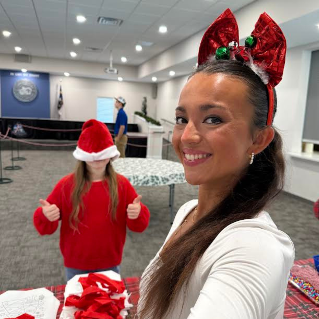 teacher with student in holiday gear