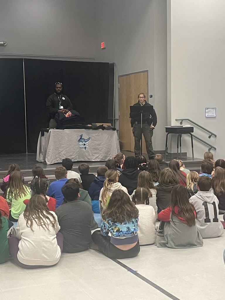5th grader students sitting in the gym listening to the DARE program