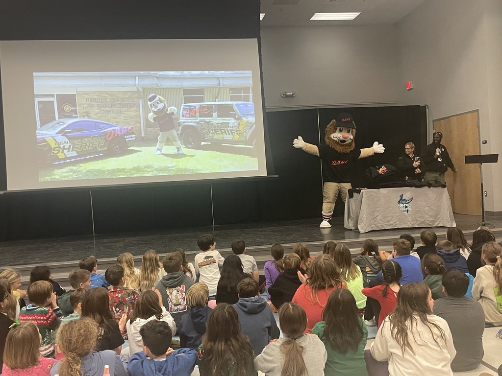 5th grader students sitting in the gym listening to the DARE program