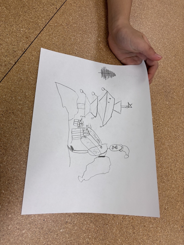 In Mrs. Morin's class, students practiced cooperative drawing with holiday themes. The challenge: draw collaboratively, one shape at a time, with no verbal communication.
