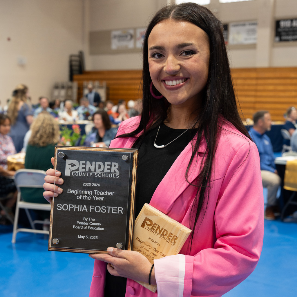 teacher holding certificate
