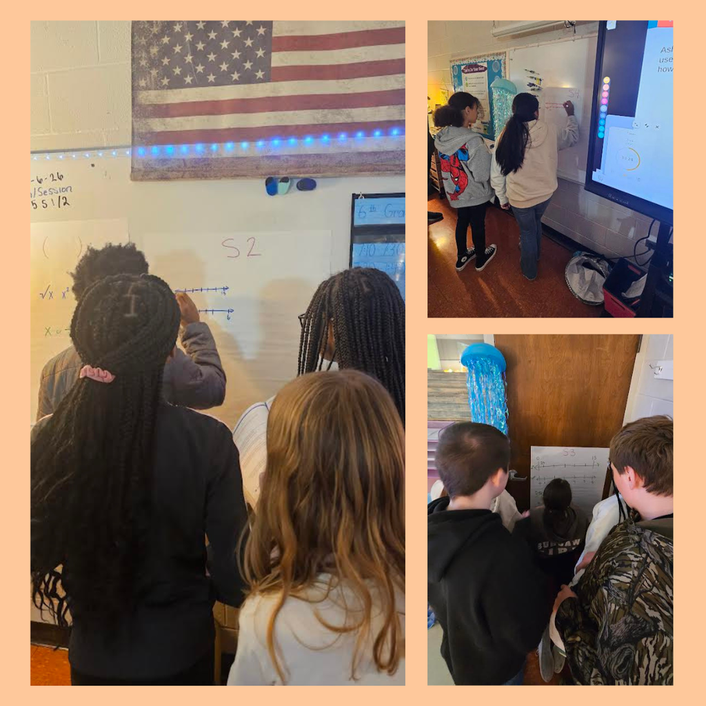 students working at board in math class