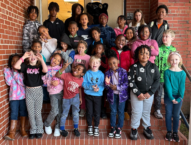 students of the week with silly faces and gestures being made