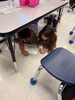 first graders partner reading