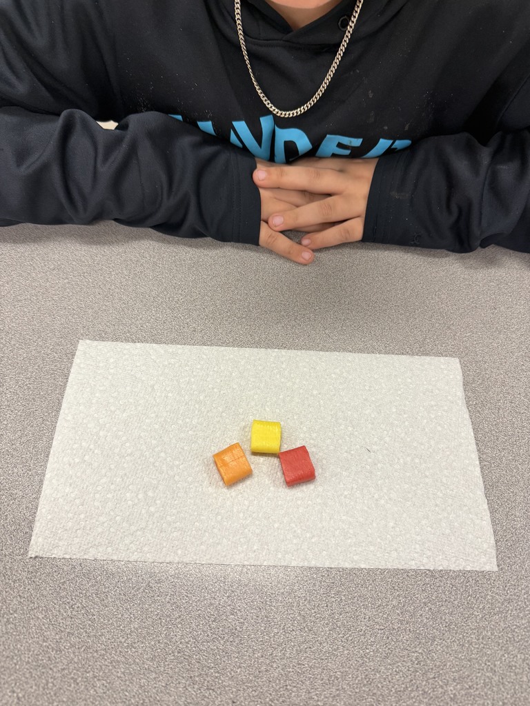 starbusts unwrapped on a students desk