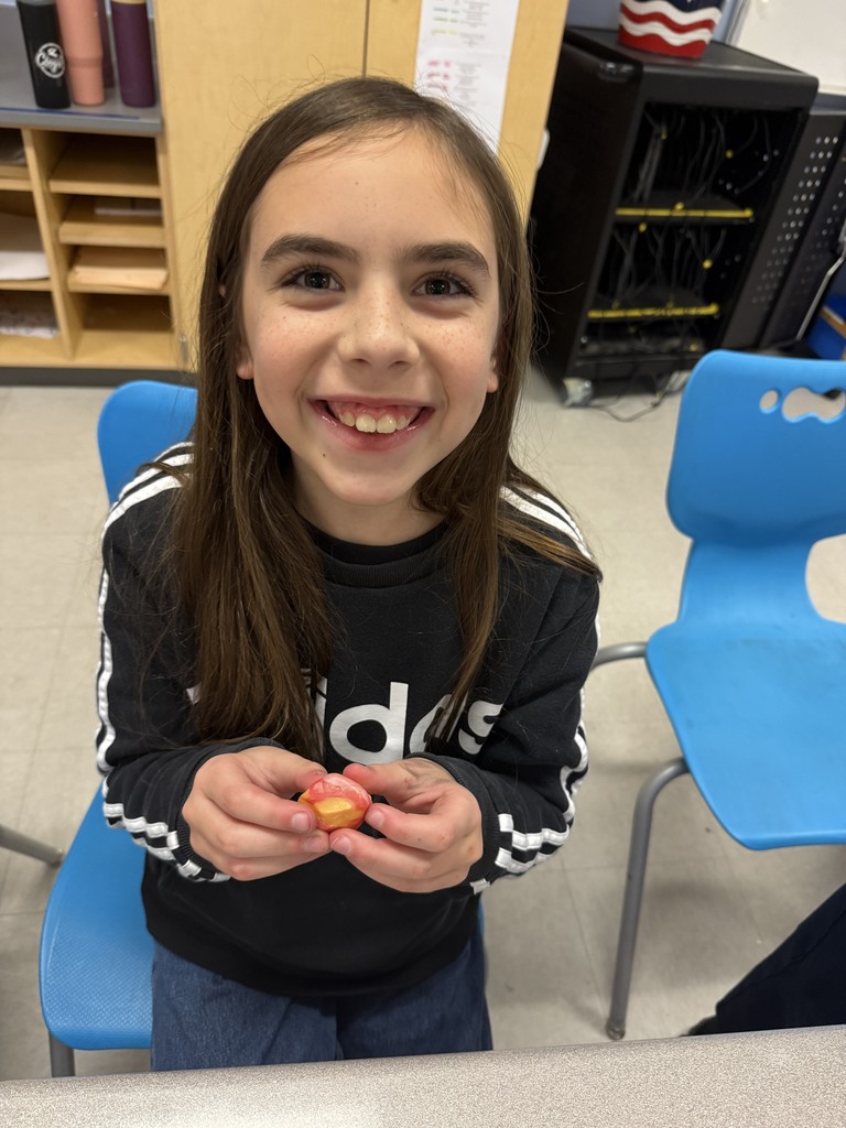 students working with unwrapped starbusts at their desk