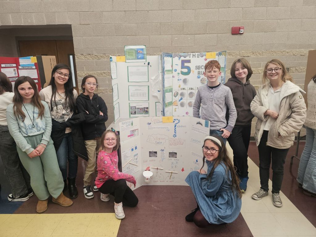 SCE students standing on stage at district science fair competition
