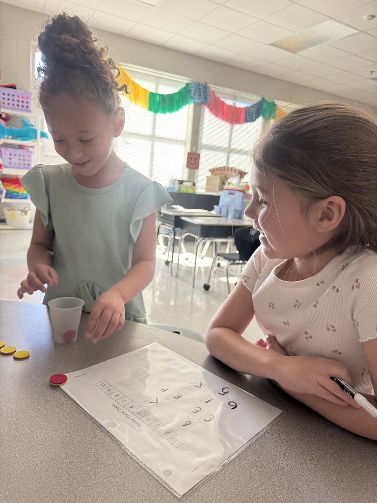 Kindergarten students working on a number bond activity in pairs