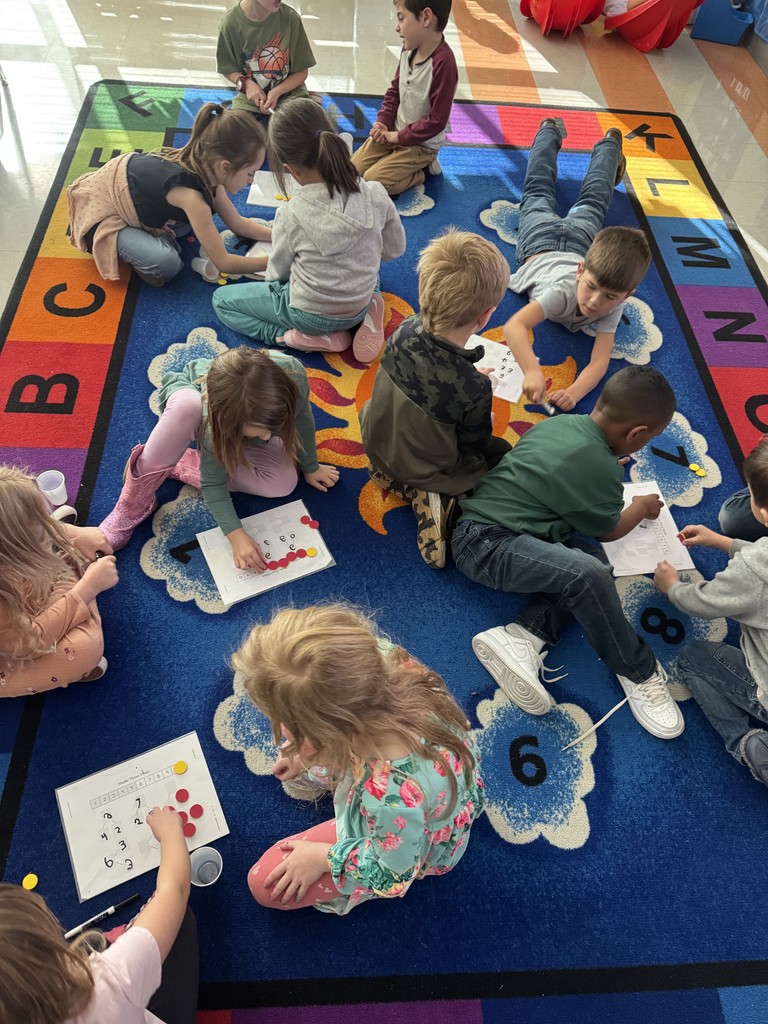 Kindergarten students working on a number bond activity in pairs