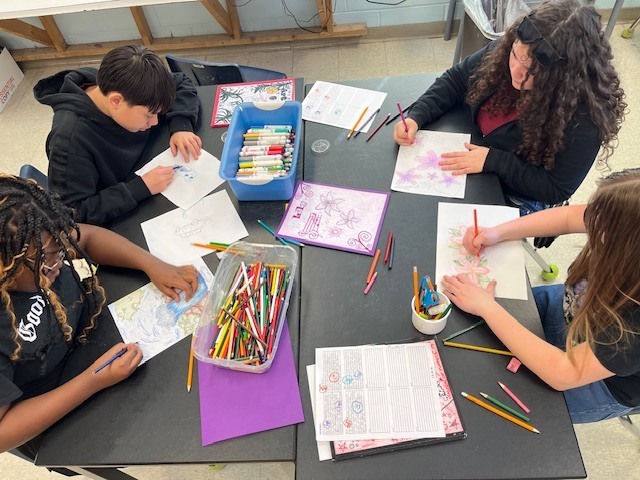 Students creating artworks for the Azalea Festival Youth Art Contest 