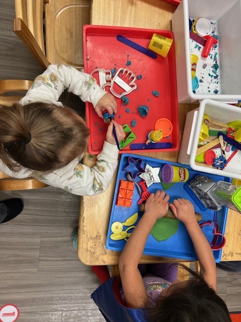 2 children playing playdough