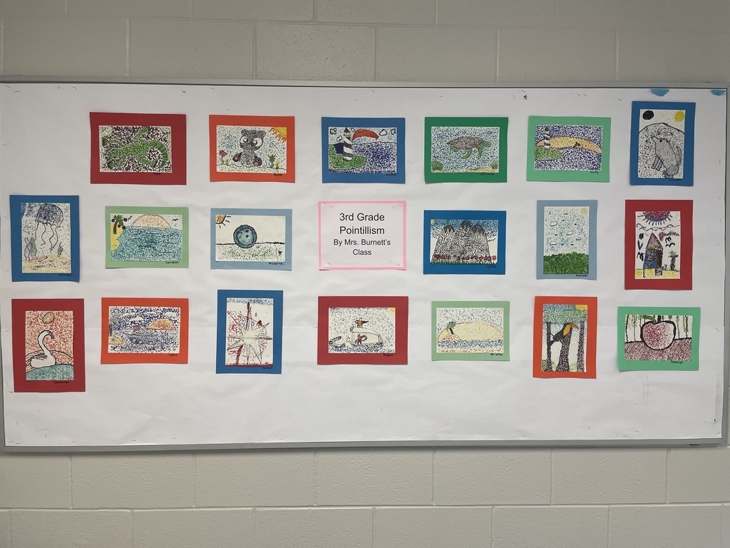 art work hanging in the hallway