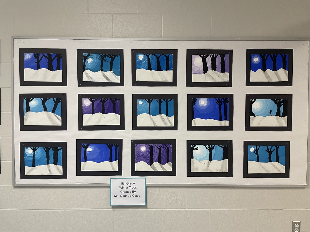 art work hanging in the hallway