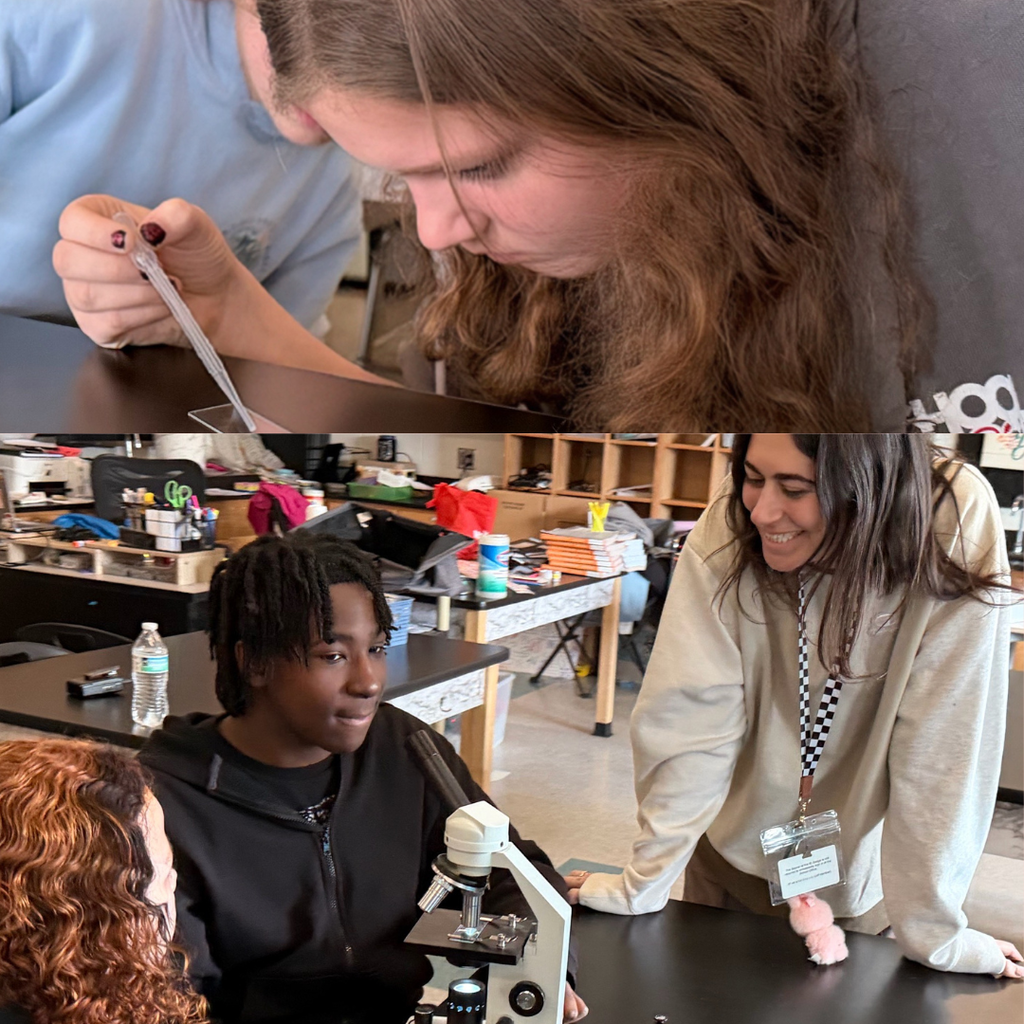 students with teacher in science class