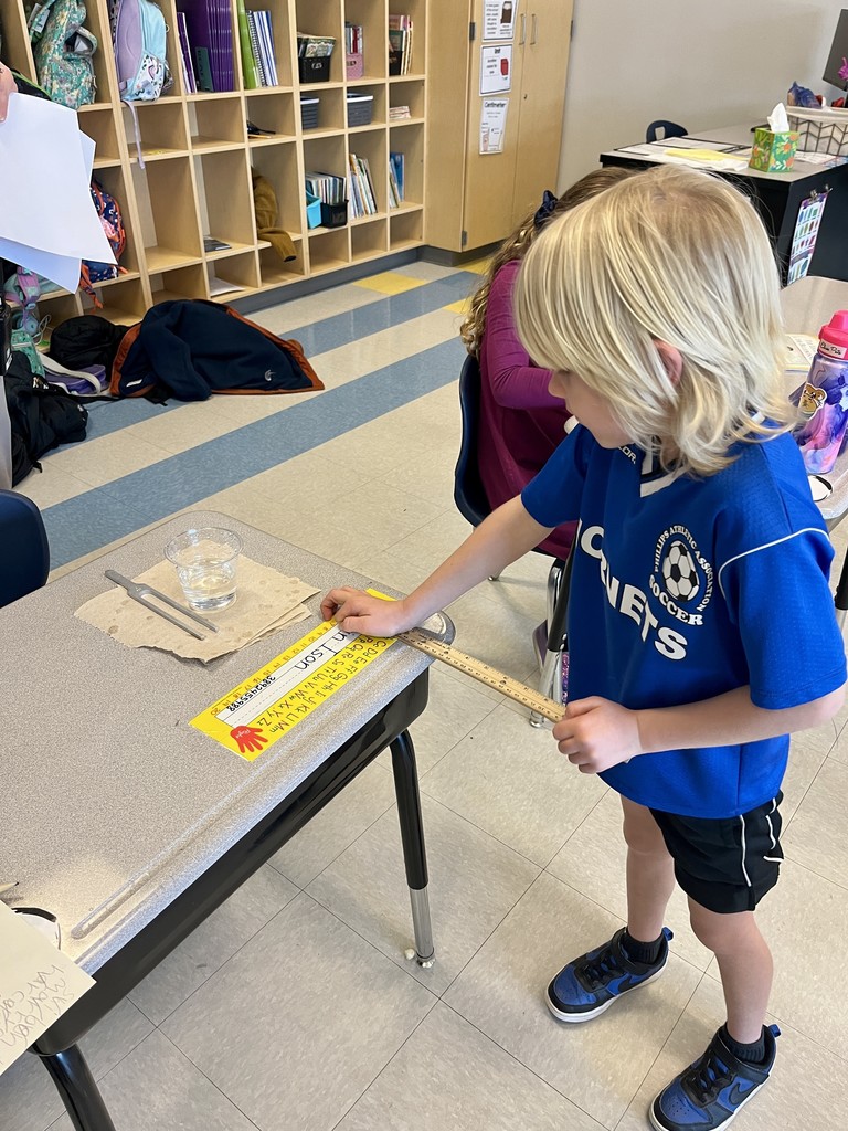 second graders working on a science experiment