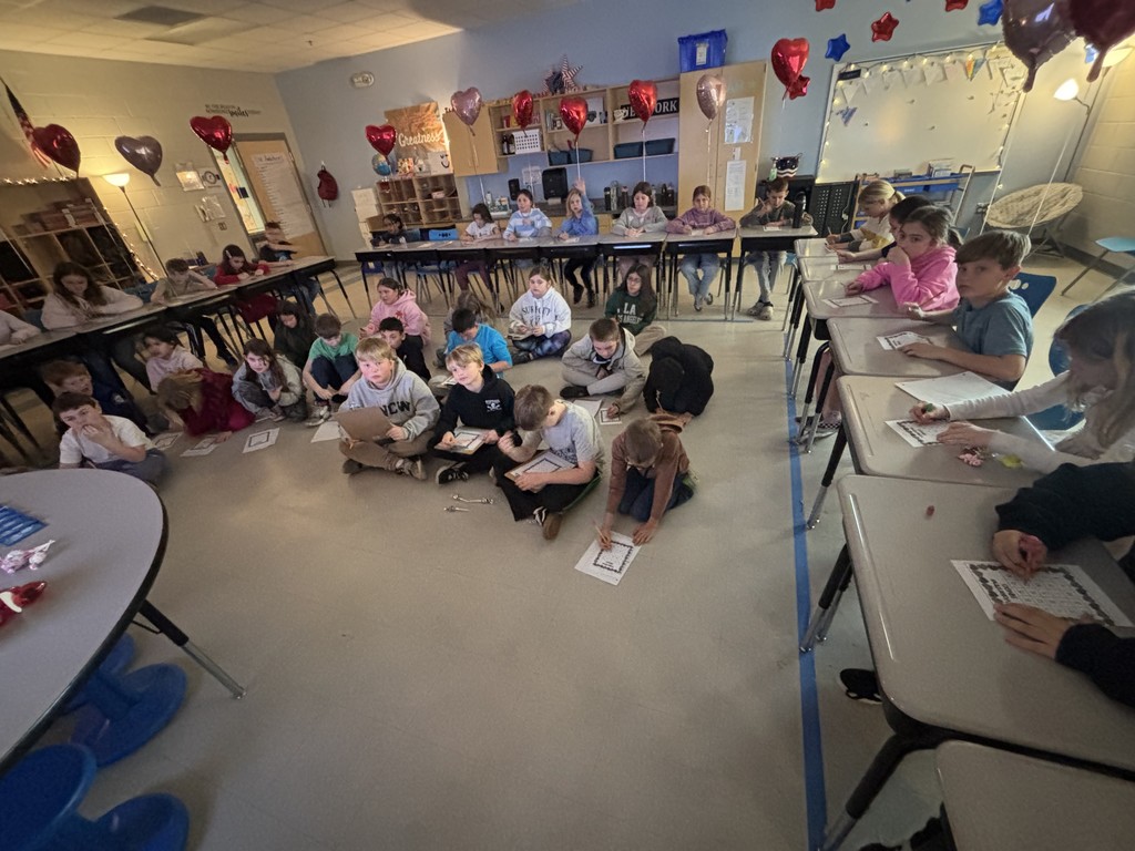fourth grade class working on a valentine's math activity