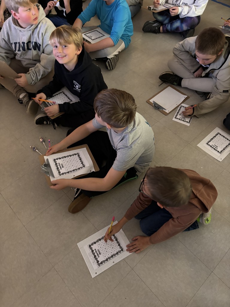 fourth grade class working on a valentine's math activity