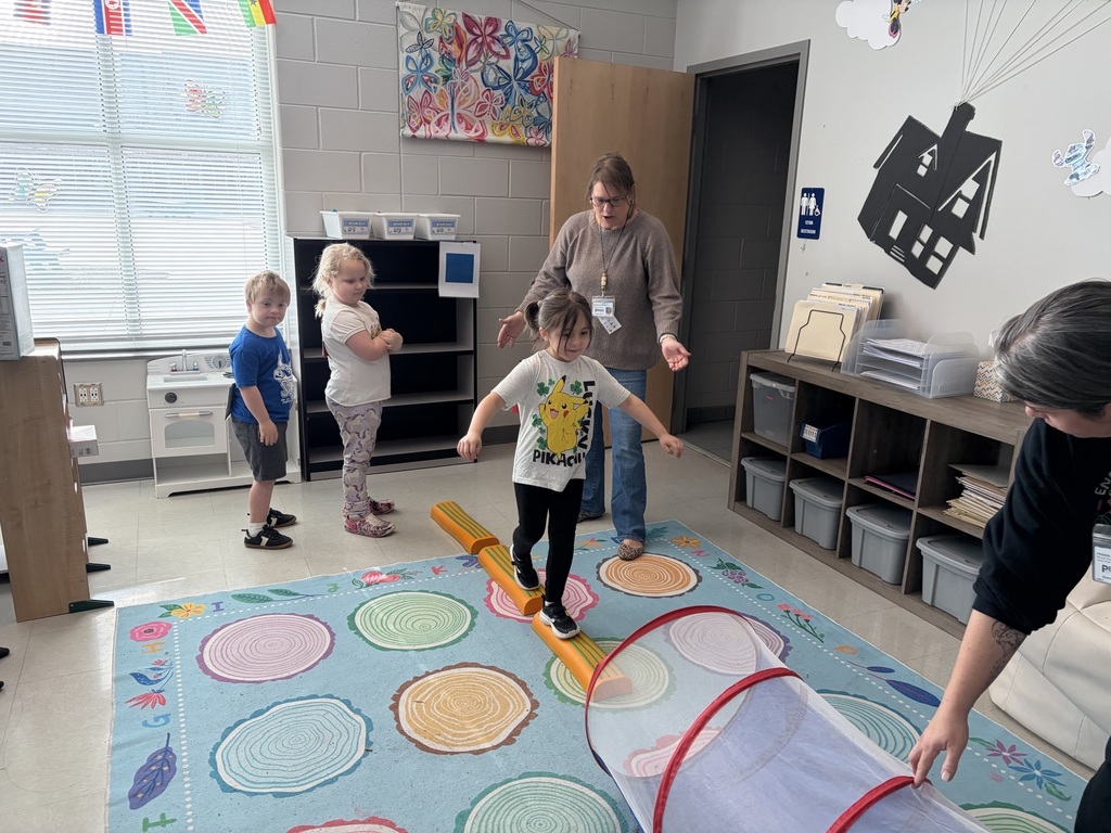 students doing winter olympic activities in a classroom