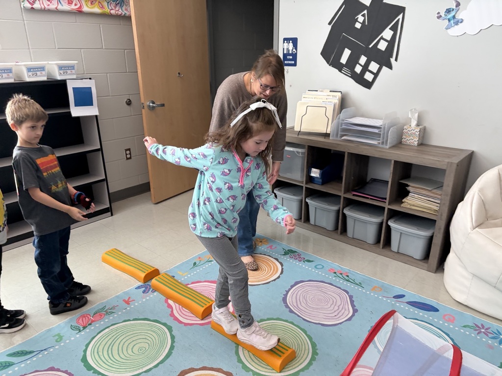 students doing winter olympic activities in a classroom