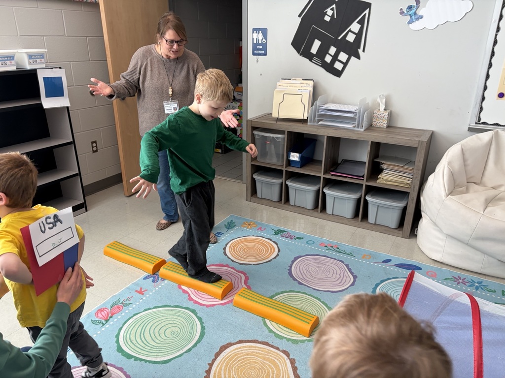 students doing winter olympic activities in a classroom