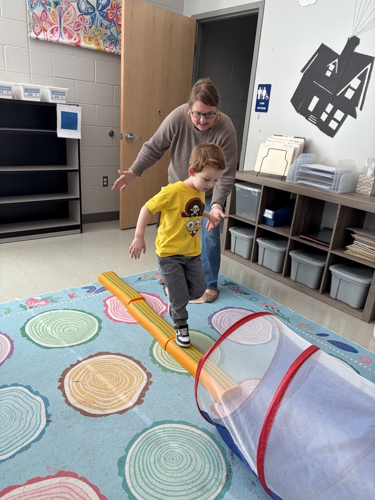 students doing winter olympic activities in a classroom