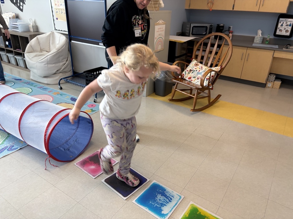 students doing winter olympic activities in a classroom