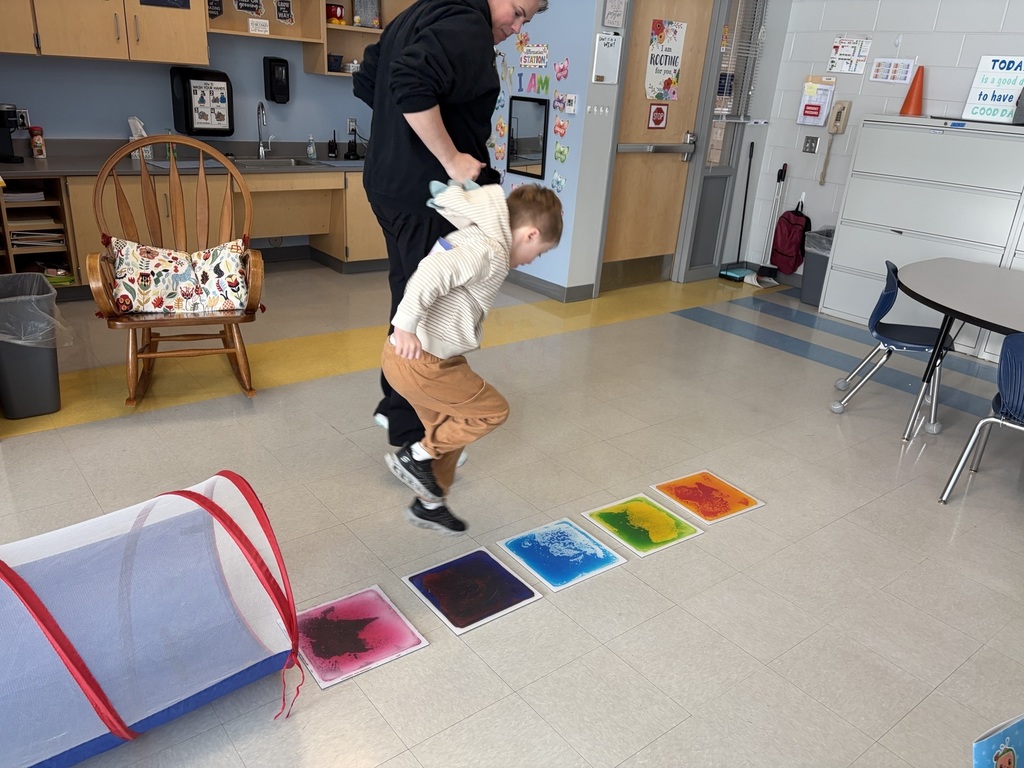 students doing winter olympic activities in a classroom
