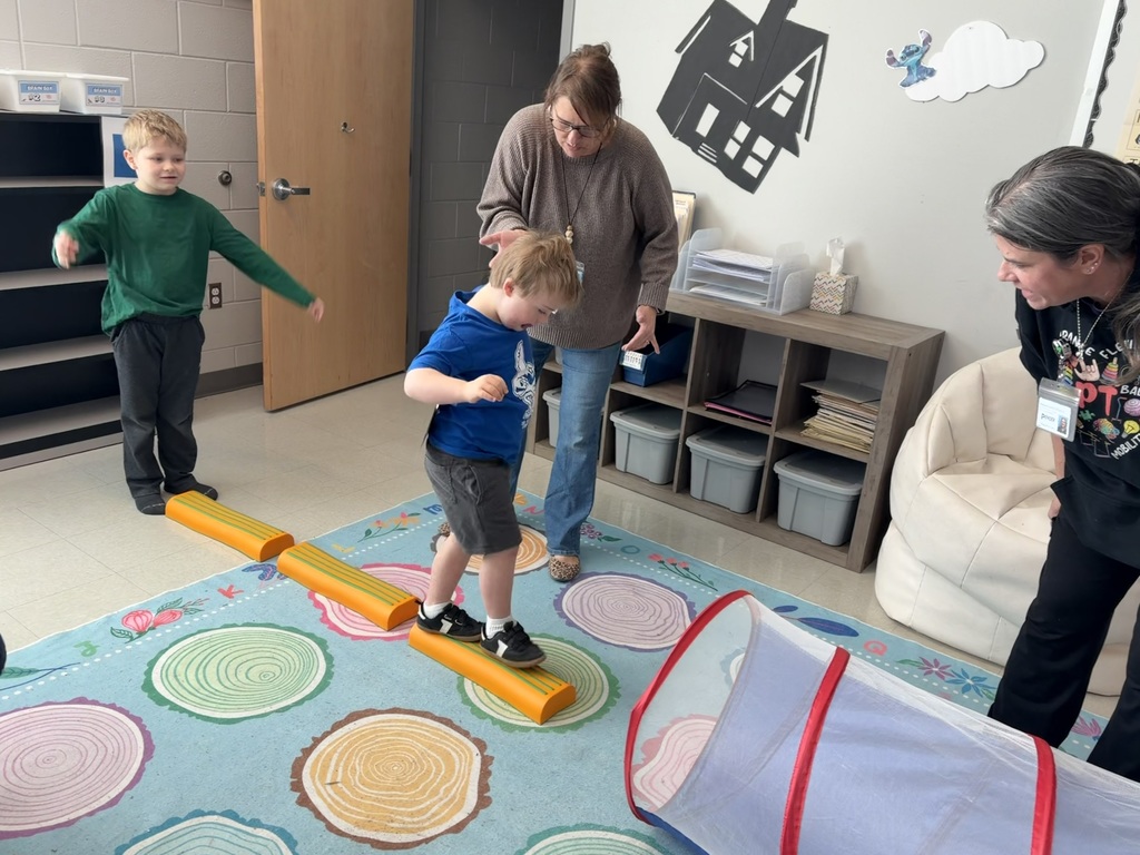 students doing winter olympic activities in a classroom
