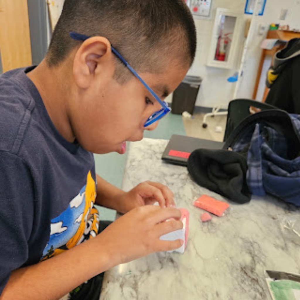 student working in science class