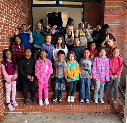 students of the week with silly faces and gestures being made