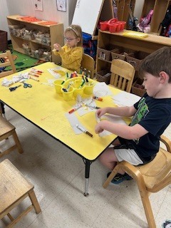 PreK students working and learning 