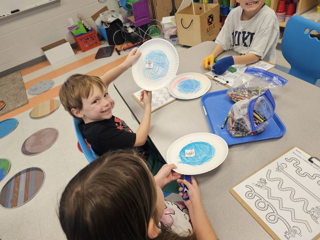 1st grade working on a magnet activity in STEAM class