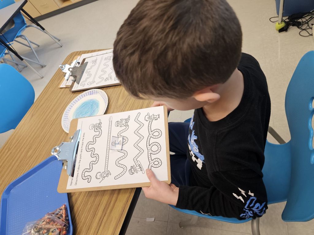 1st grade working on a magnet activity in STEAM class