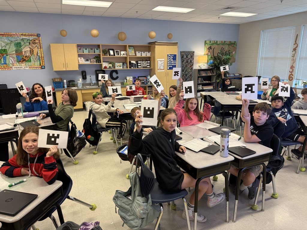 5th graders using Plickers during math test review