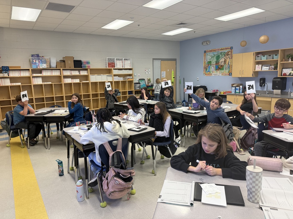 5th graders using Plickers during math test review