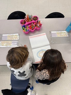 first graders working in pairs during a math game