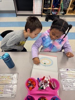 first graders working in pairs during a math game