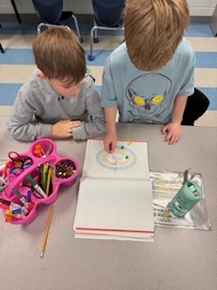 first graders working in pairs during a math game