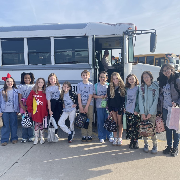 battle of the books team in front of the bus