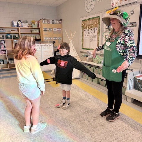 first graders doing a plant lesson with the master gardeners 