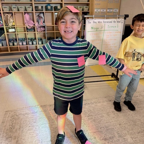 first graders doing a plant lesson with the master gardeners 