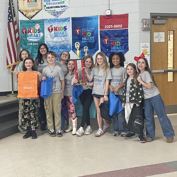 battle of the books team holding trophy 